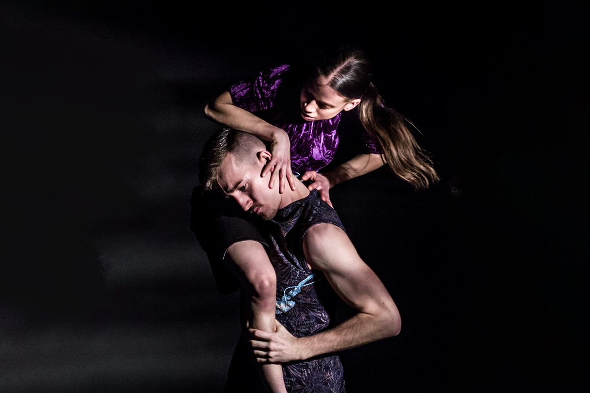 Two contemporary dance students in a dark setting at London Studio Centre